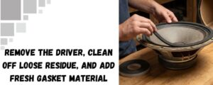 The image shows a guy fixing a speaker driver